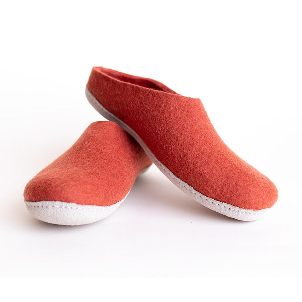 stacked pair of wool felt slippers in spice red orange color