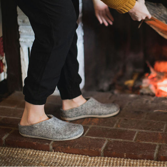staying cozy by the fire in warm wool slippers